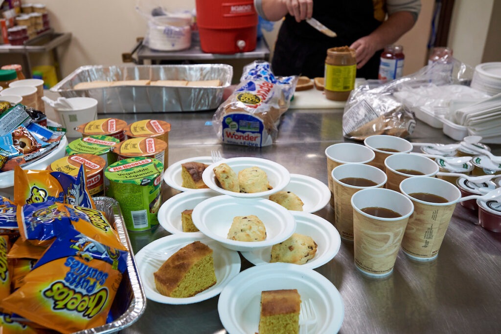 Prepared meals and snacks for residents at a low-barrier shelter in Kitchener, Ontario, supporting individuals transitioning to stable housing.