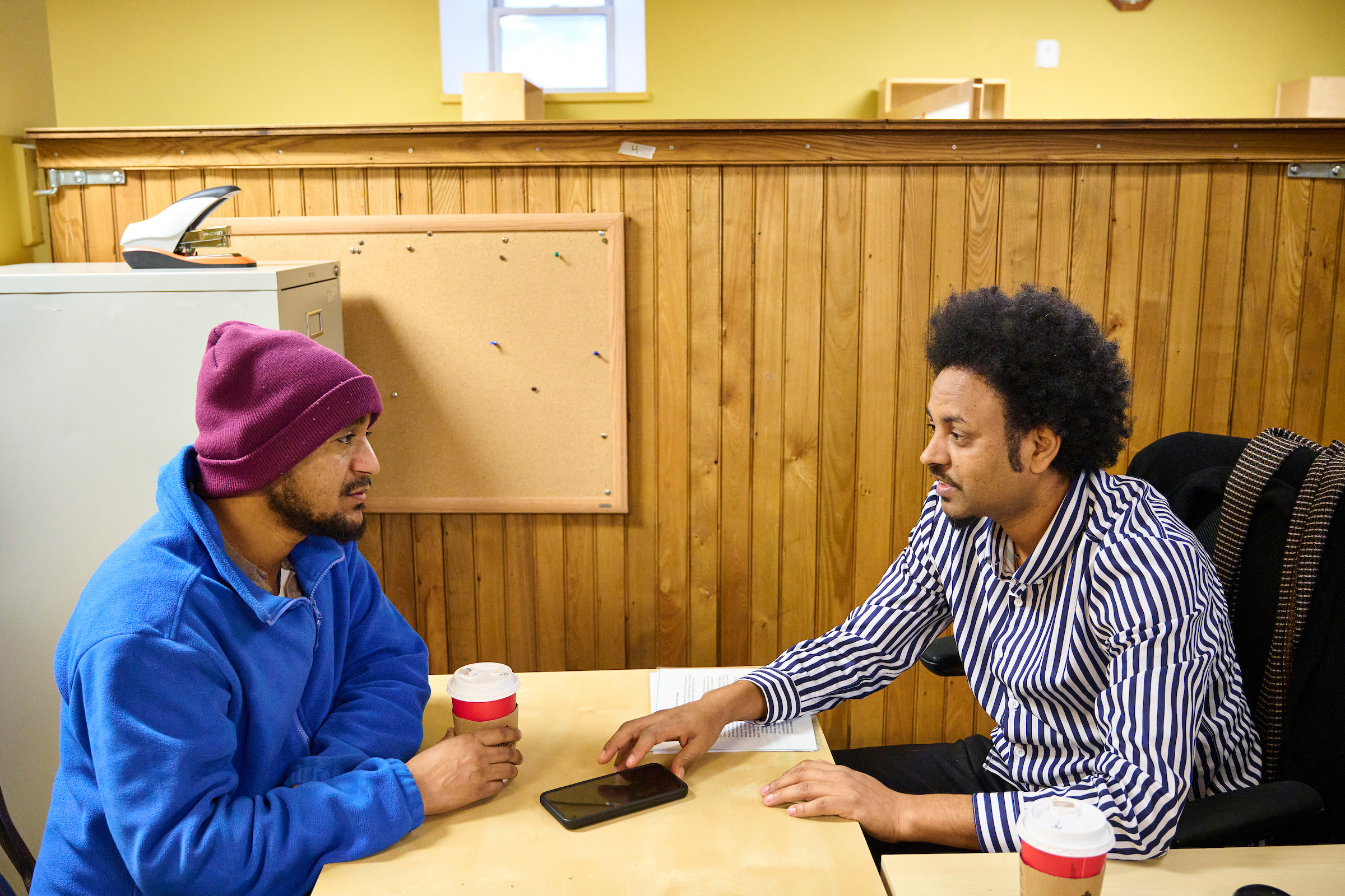 Berhane and Zelalem, an employment counselor, in a focused conversation at the Job Search Resource Centre, Kitchener.