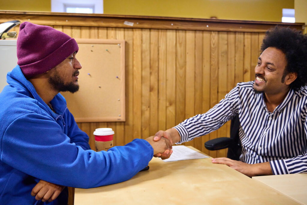 An employment counselor and job seeker, at the Job Search Resource Centre, Kitchener.