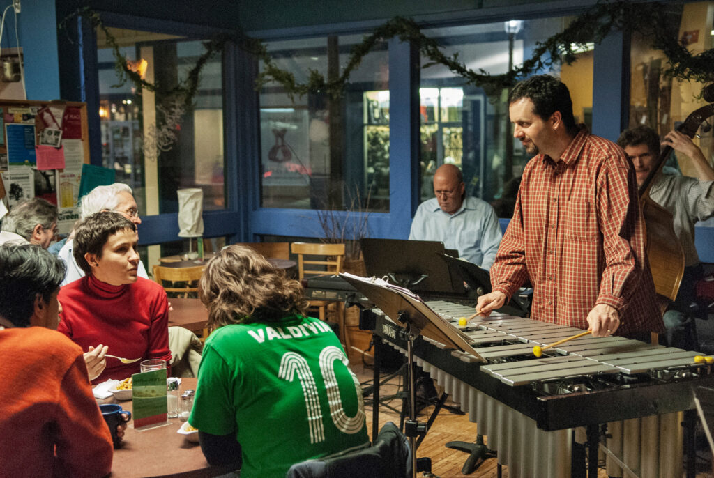 A live music performance at The Working Centre with a vibraphone player engaging the audience in Kitchener, Ontario.